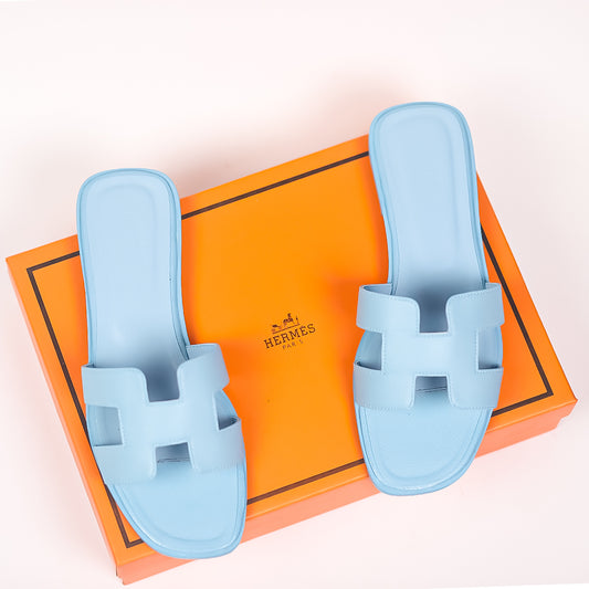 Hermes Oran Slippers in Light Blue