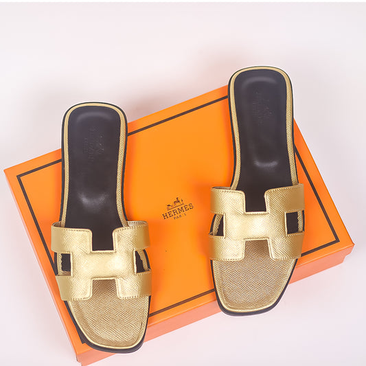 Golden Noir Elegance: Hermes Oran Slippers